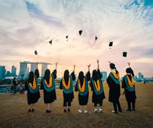 Graduate student with diploma at graduation ceremony